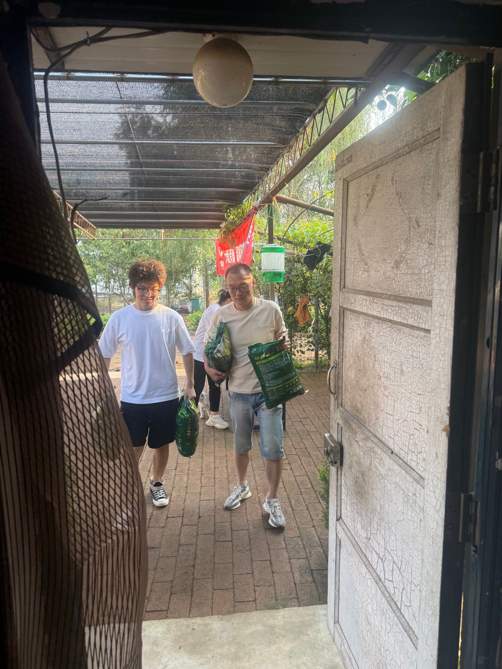 Our Team Carrying Cat Litter and Cat Food